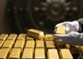 Gold breaks $5,000 an ounce for first time as investors flee to safety